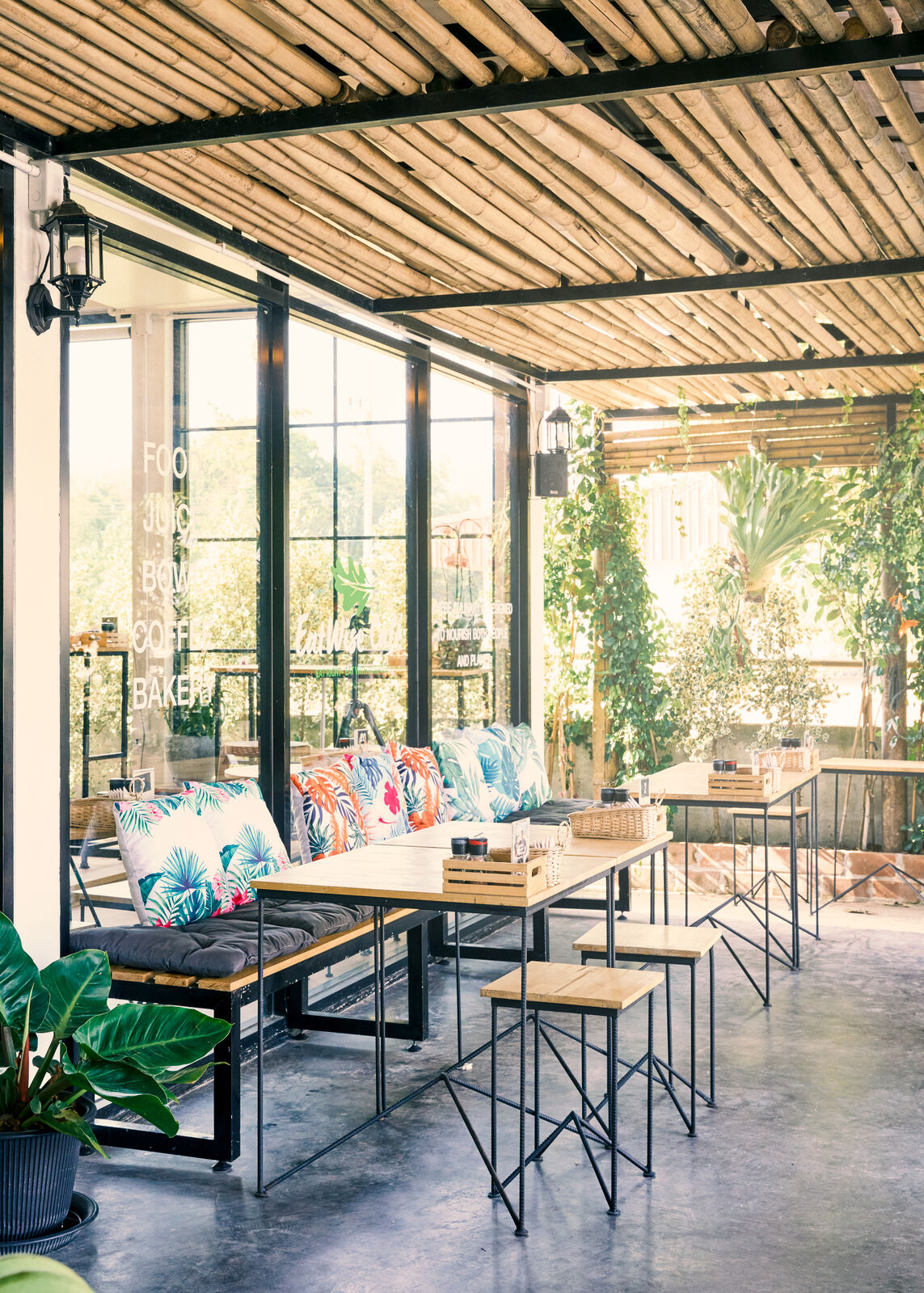 Café veranda seating under bamboo