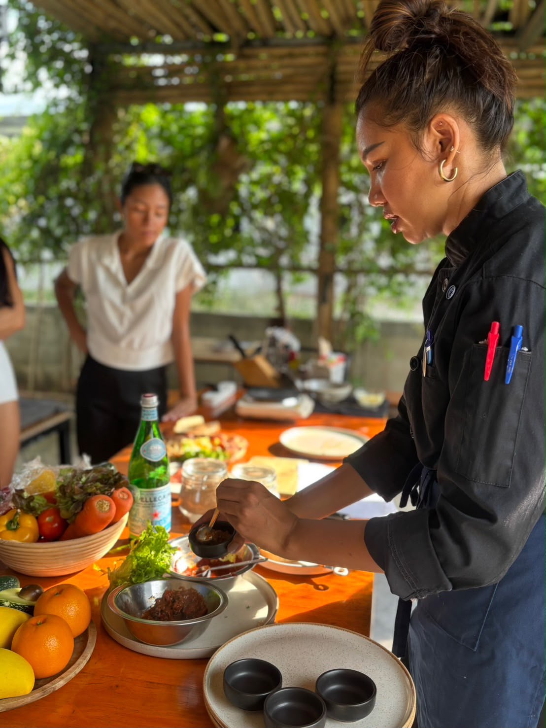 Chef preparing sauces at a plant-based cooking class