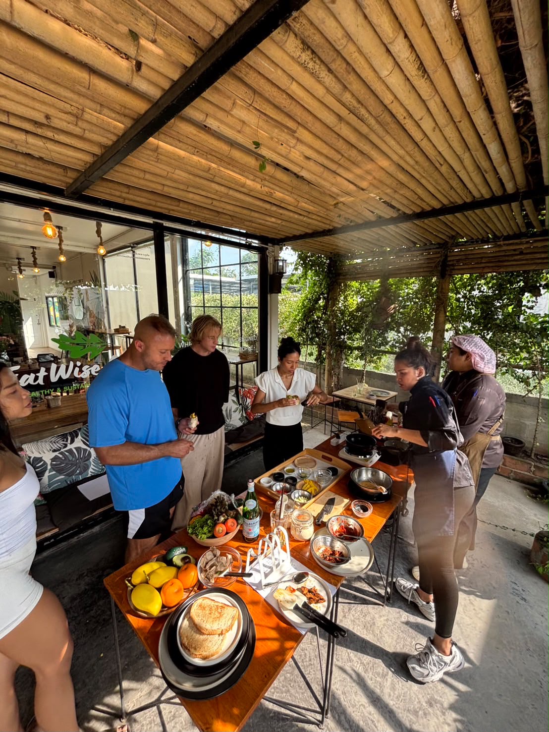 Outdoor plant-based cooking class under the bamboo pergola